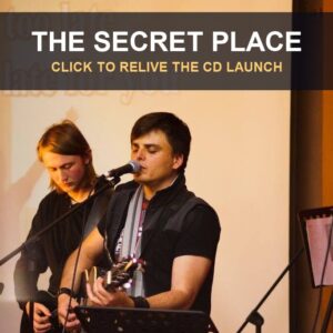 Barend Botha leading worship with a guitar at The Secret Place CD launch